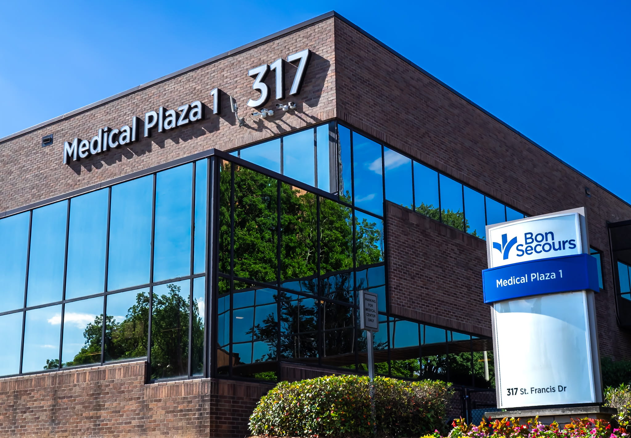 photo of glass and brick medical plaza building