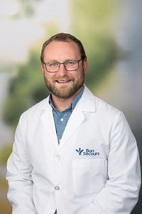 Daniel Olson, male doctor in a white lab coat