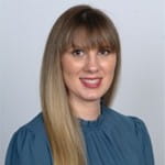 Brittany Chatham. Woman, long straight hair. bangs, blue top.